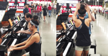 employee-and-customer-sit-at-pianos-in-a-store-improvise-an-impromptu-version-of-hit-song